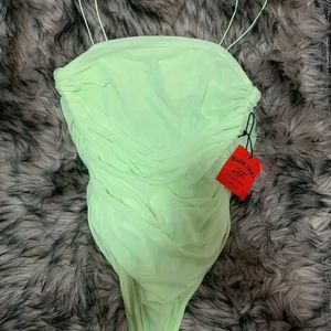 Soft lime green bodysuit that’s ruched on the side